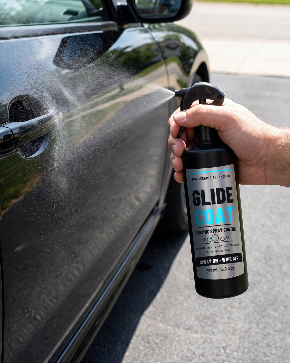 Spraying GlideCoat on a clean black car door